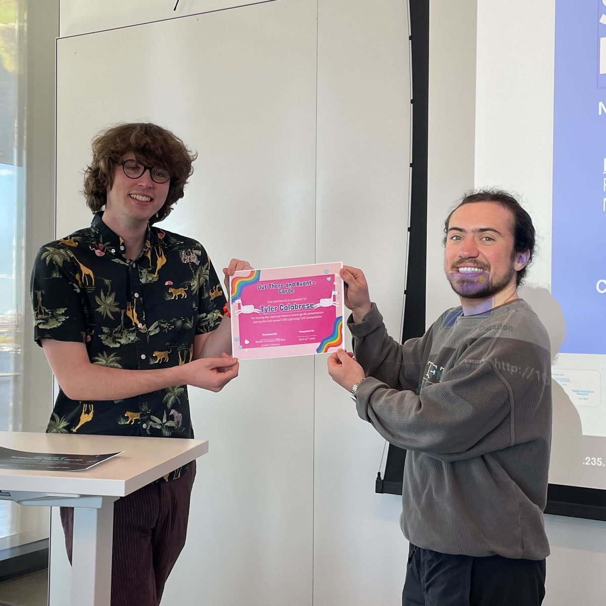 Tyler Calabrese holding the Out There and Avant-Garde certificate