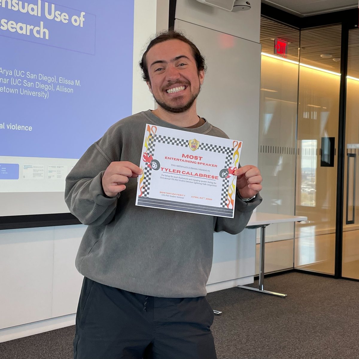 Tyler Calabrese holding the Most Entertaining Speaker certificate